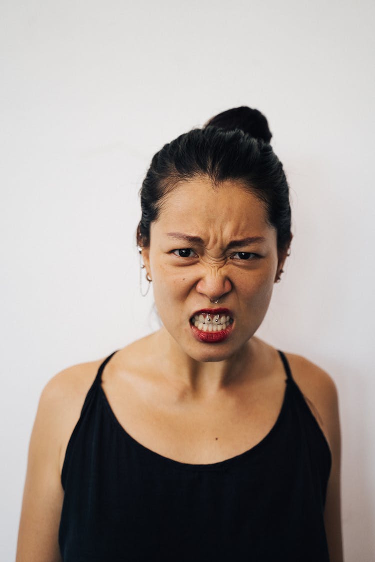 An Angry Woman With A Black Top