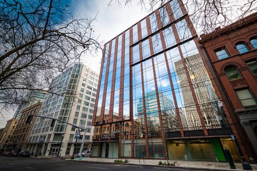 Free From below of contemporary building with glass walls located in residential district of city in daylight Stock Photo