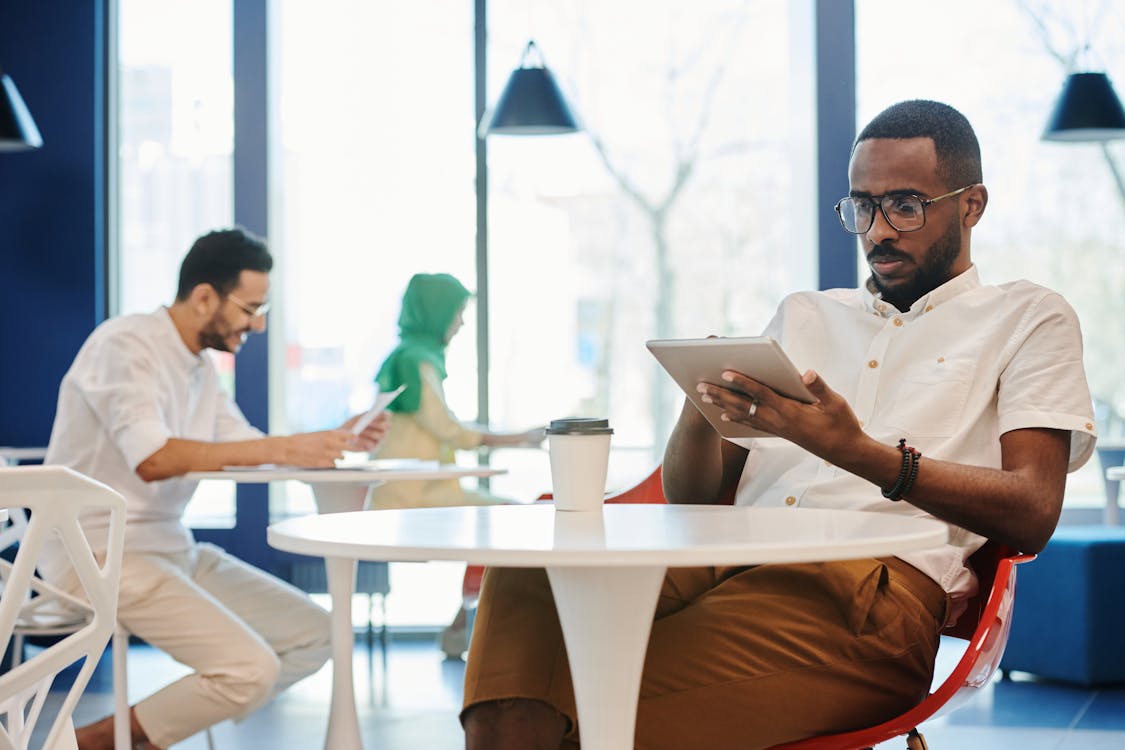 A Man Sitting at the Table · Free Stock Photo