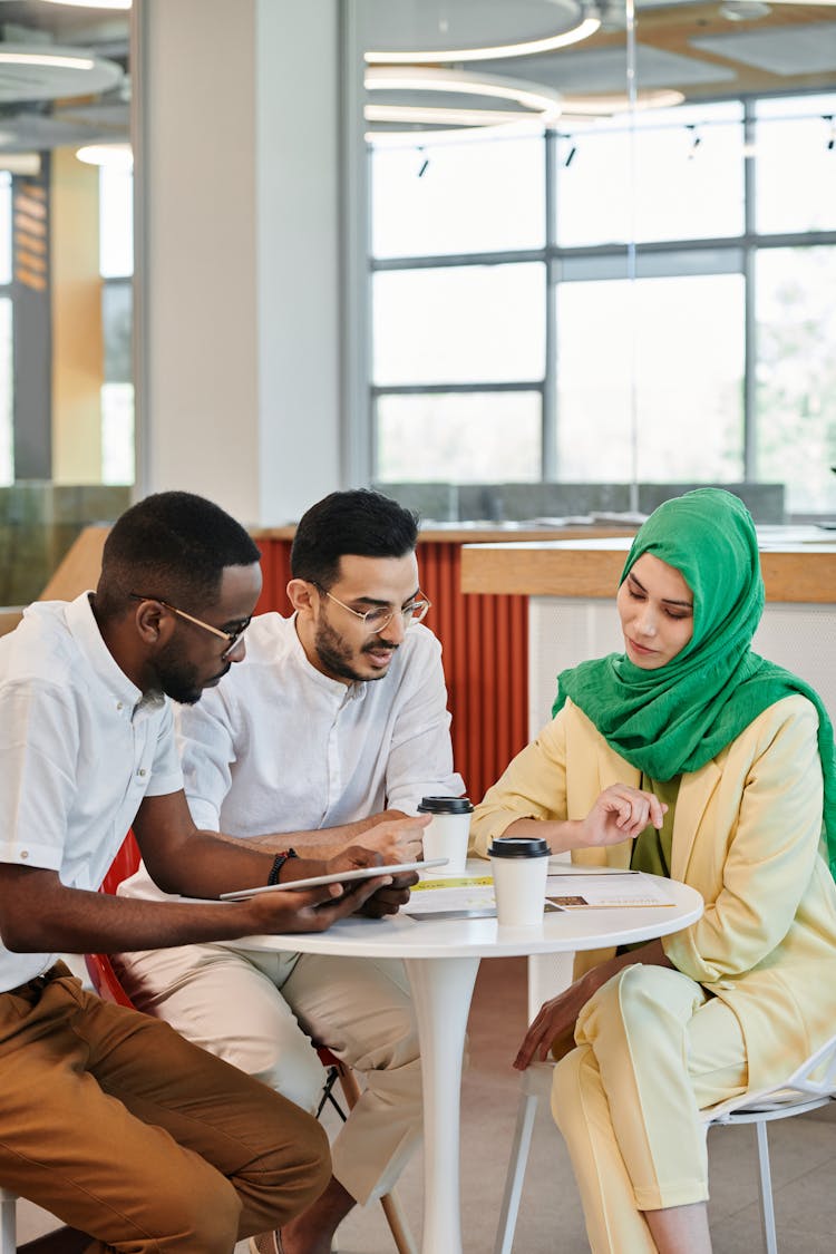 Multicultural People On A Meeting In Cafeteria 