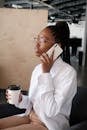 Black businesswoman speaking on smartphone