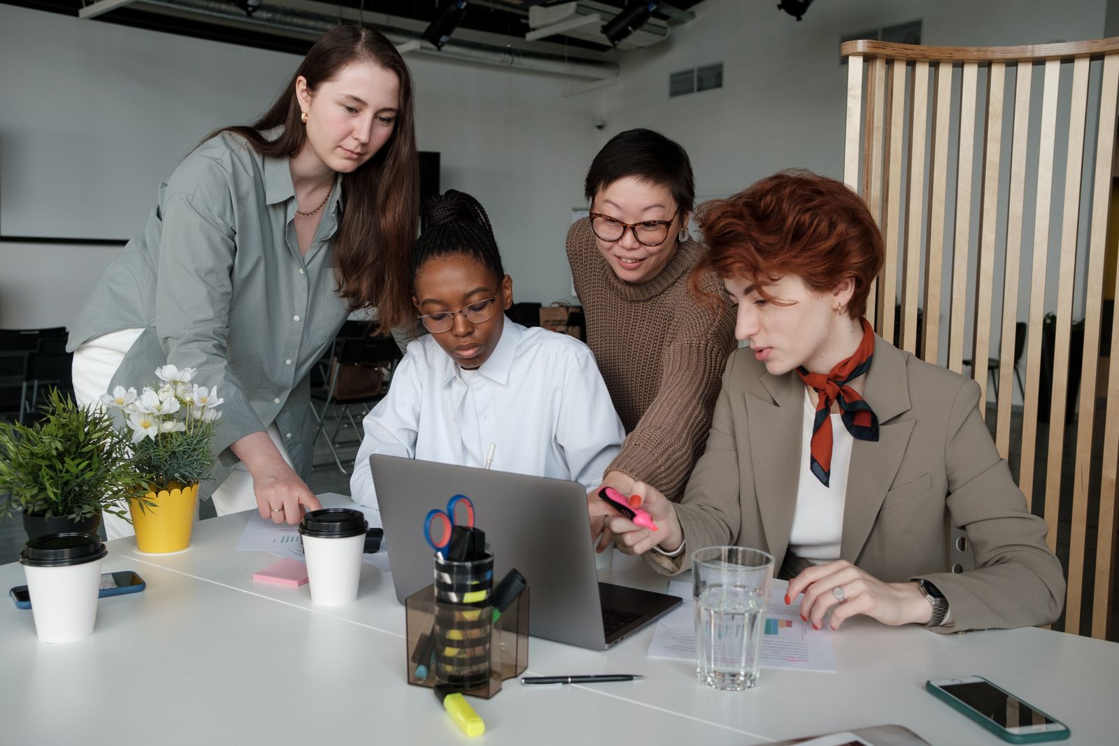 Women participating in a collaborative leadership meeting