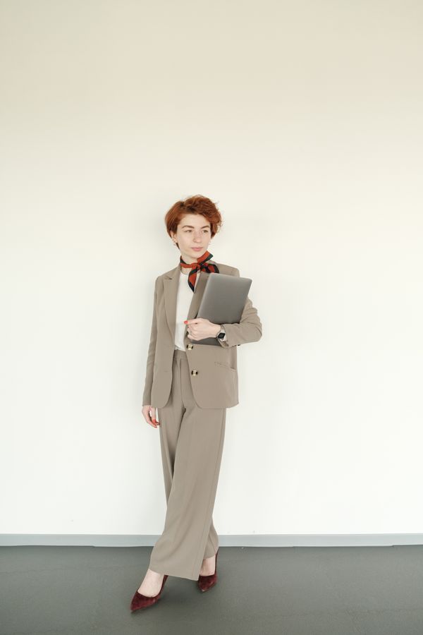 Woman wearing a cardigan as a top with tailored pants