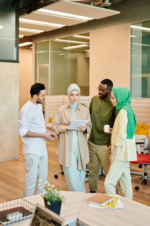 Free People Having a Discussion at the Office Stock Photo
