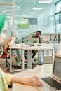 People Sitting on Chair in Front of Table