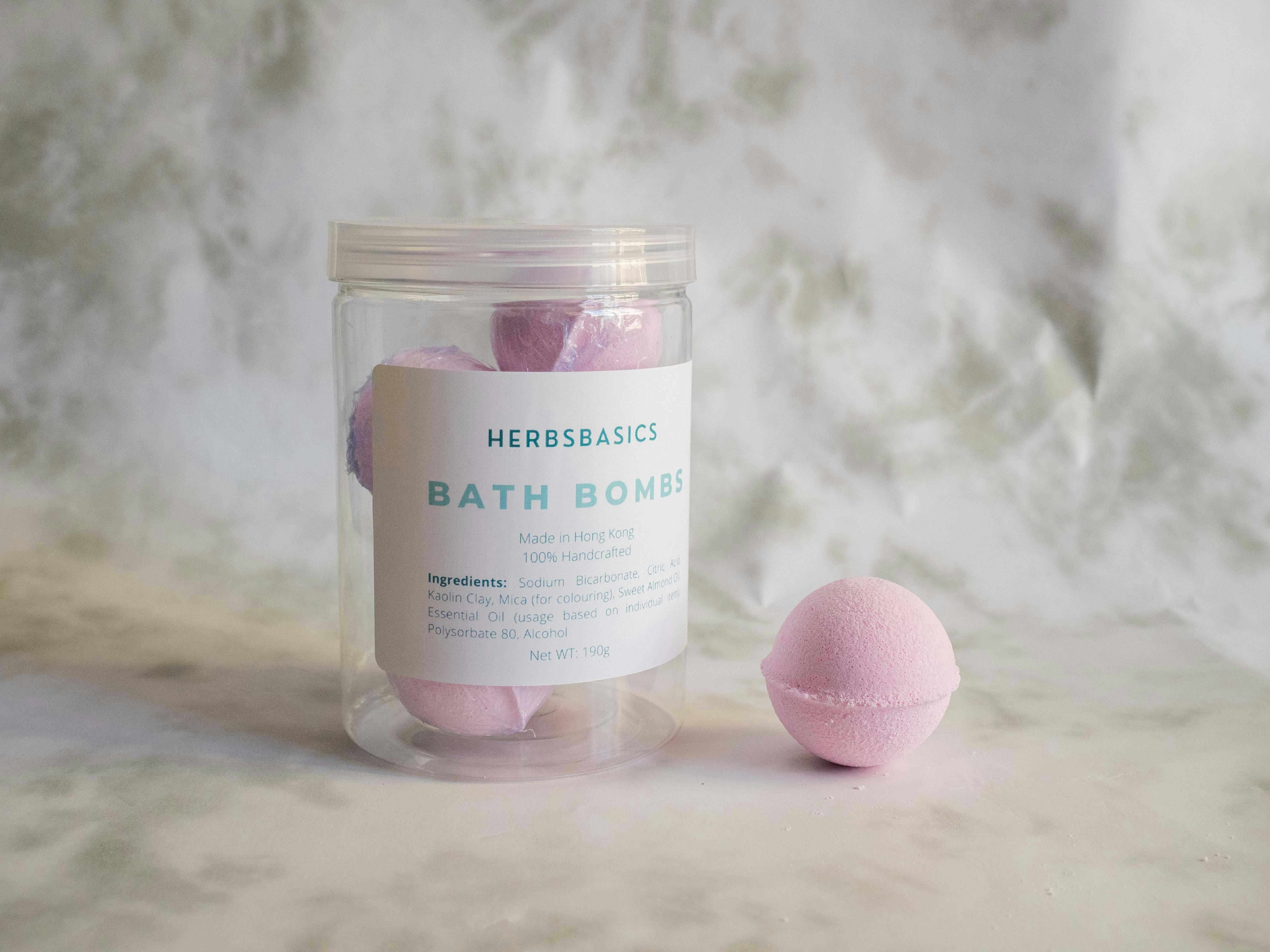 Elegant pink bath bombs displayed in a clear jar, perfect for relaxation.
