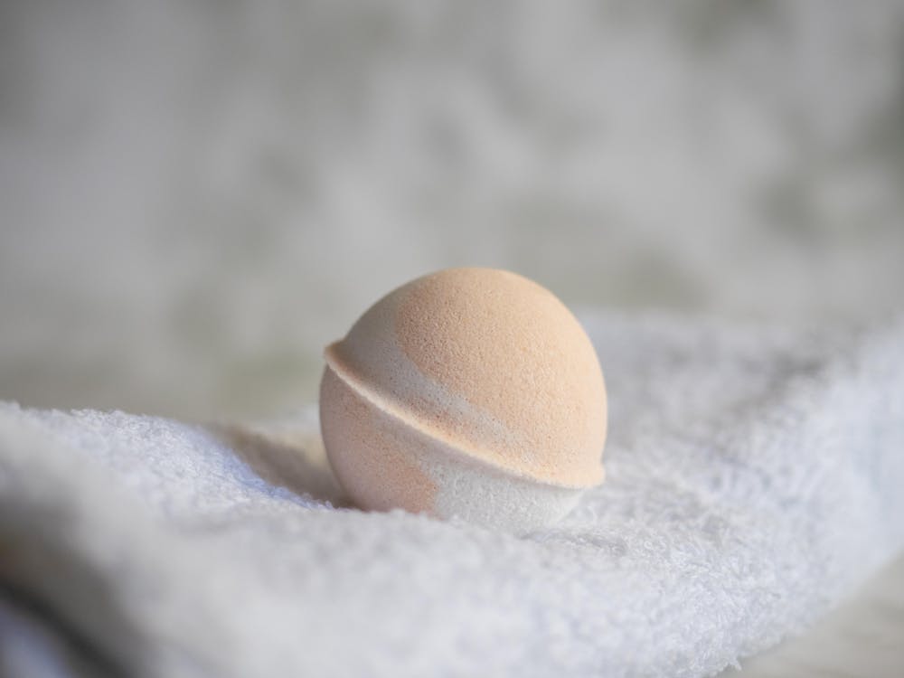 Close Up Photo of Bath Bomb on White Towel