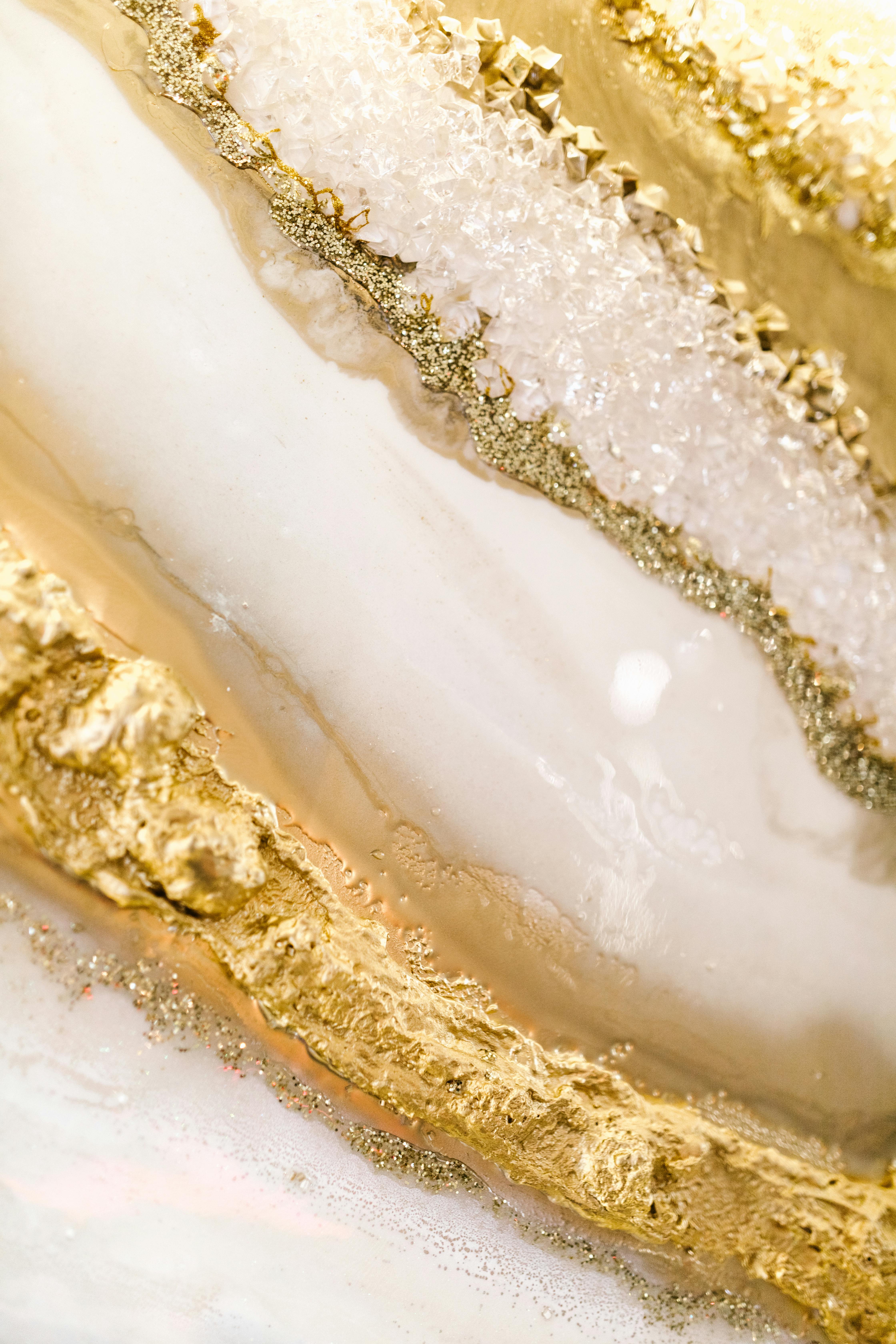 closeup of a white paint with golden glitter