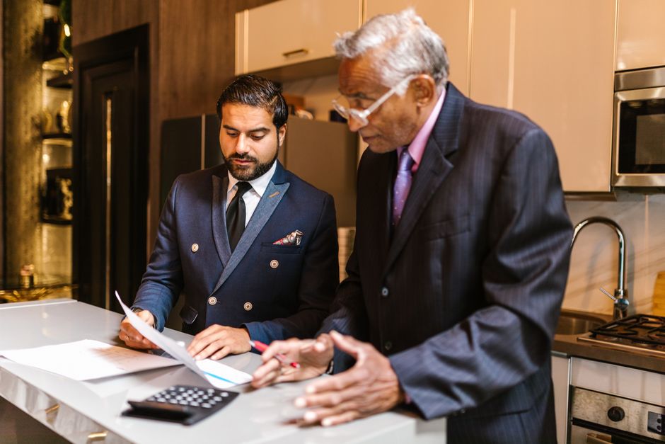 Business consultant reviewing investment requirements and fee structures with client