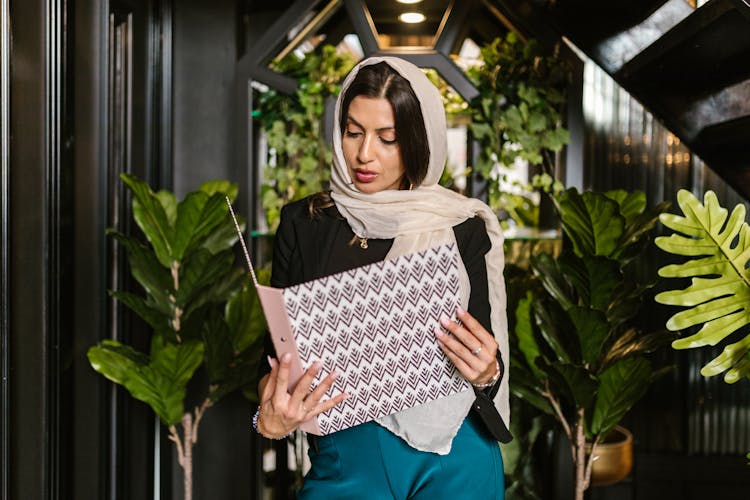 Woman Holding A Binder