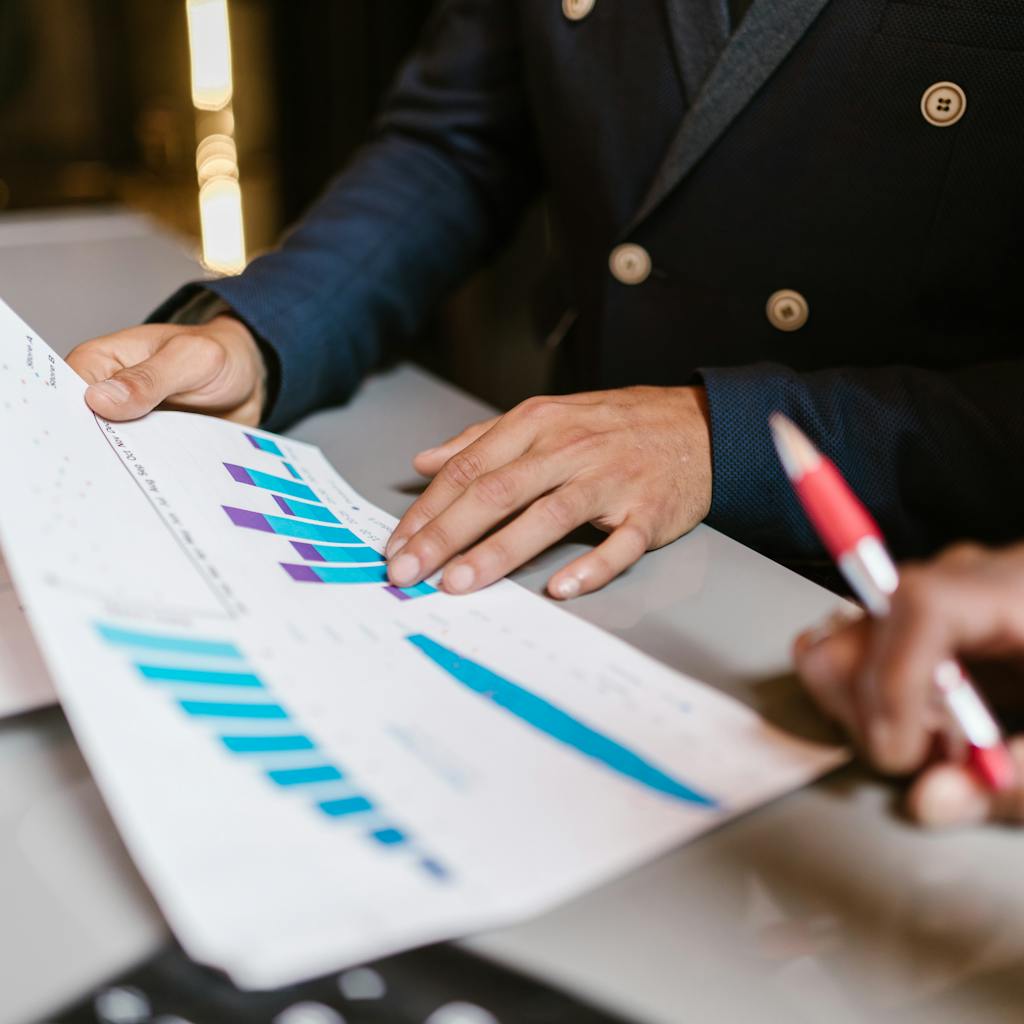 Businesspeople reviewing marketing charts and graphs.