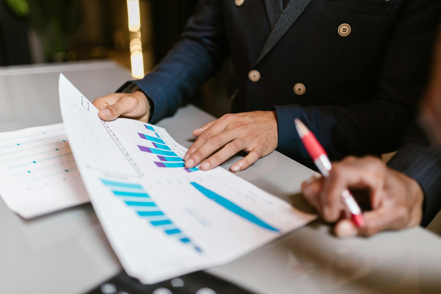 Team reviewing financial performance graphs and charts