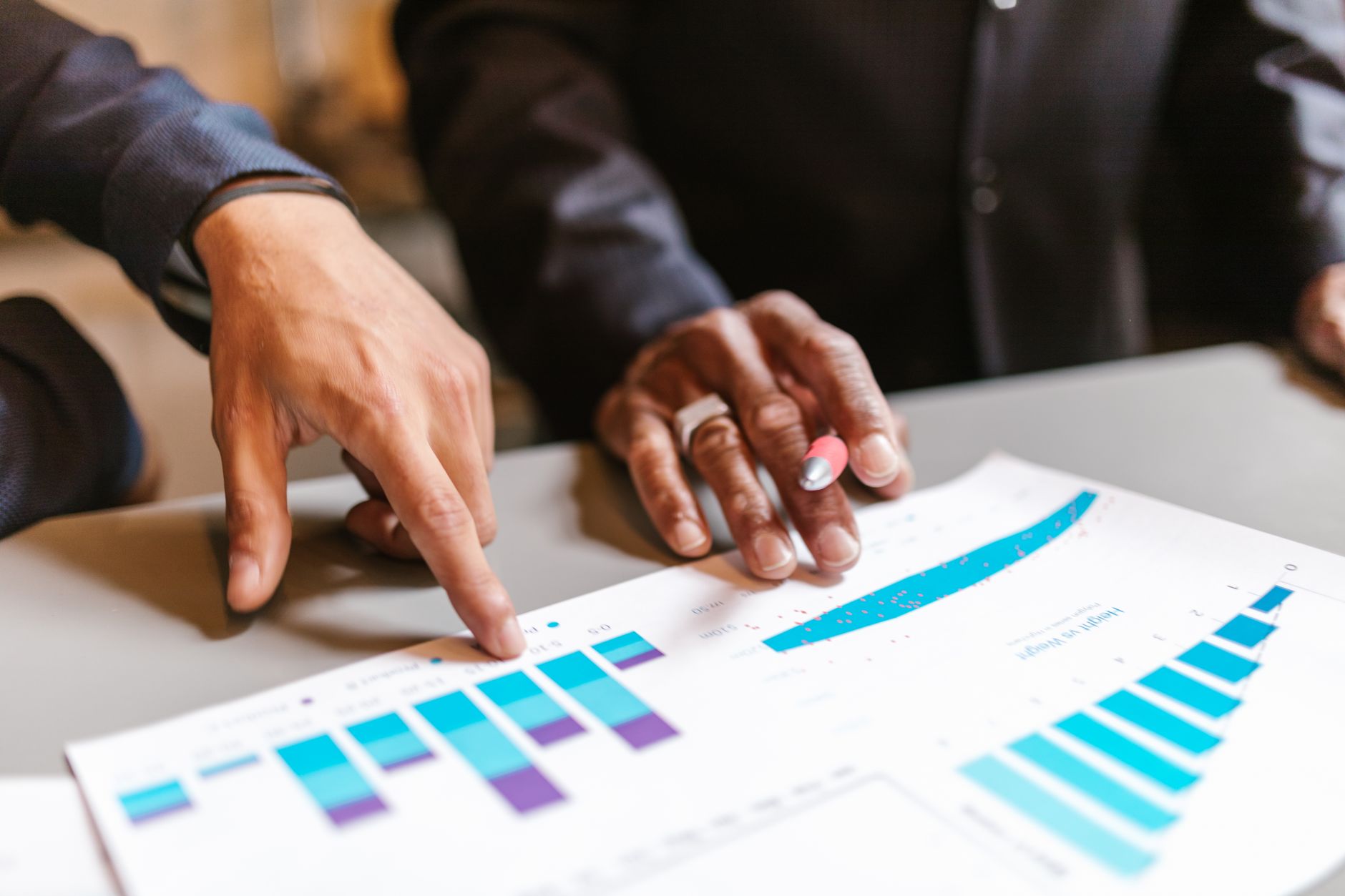 SEO Page Business professionals analyzing charts and graphs during a meeting