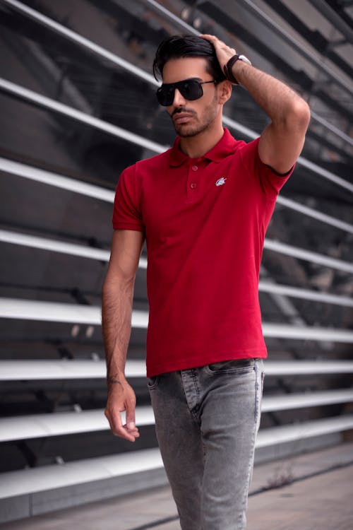 Man Wearing Red Polo Shirt Touching his Hair · Free Stock Photo