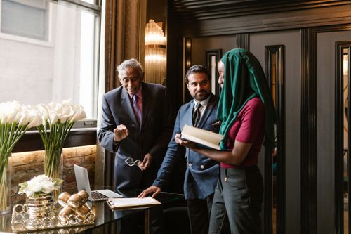 Free A diverse group of professionals collaborating in a modern office environment, showcasing teamwork and business strategy. Stock Photo
