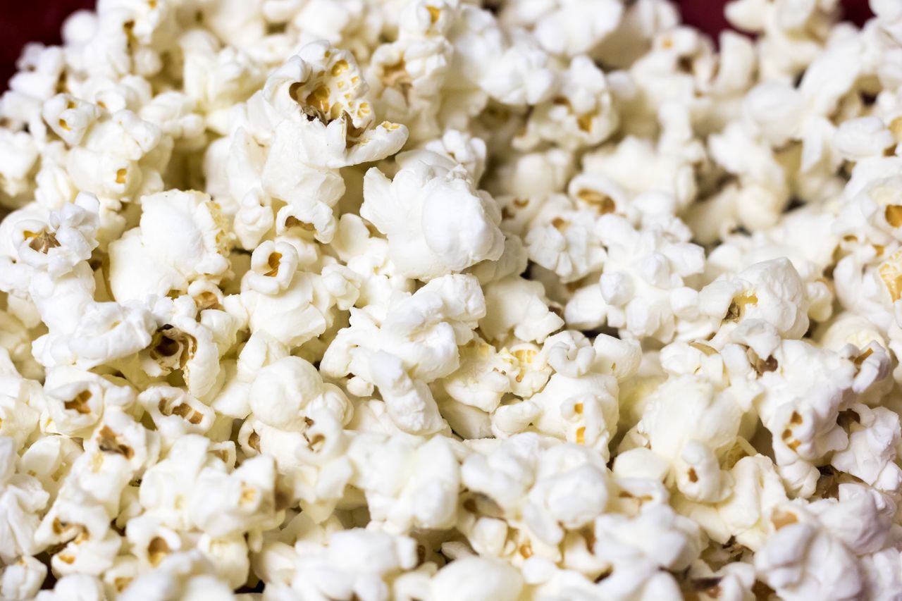 delicious and fluffy popcorn kernels in a close up shot ready to enjoy