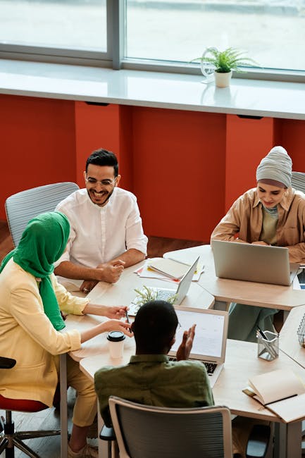 A diverse group of people collaborating on a creative project using futuristic technology, with a sense of optimism and excitement.