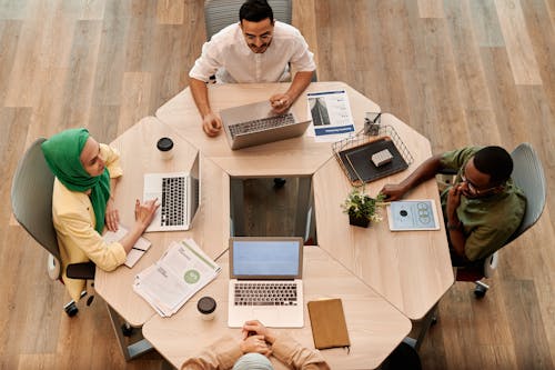 Photo of People Having a Meeting at the Office