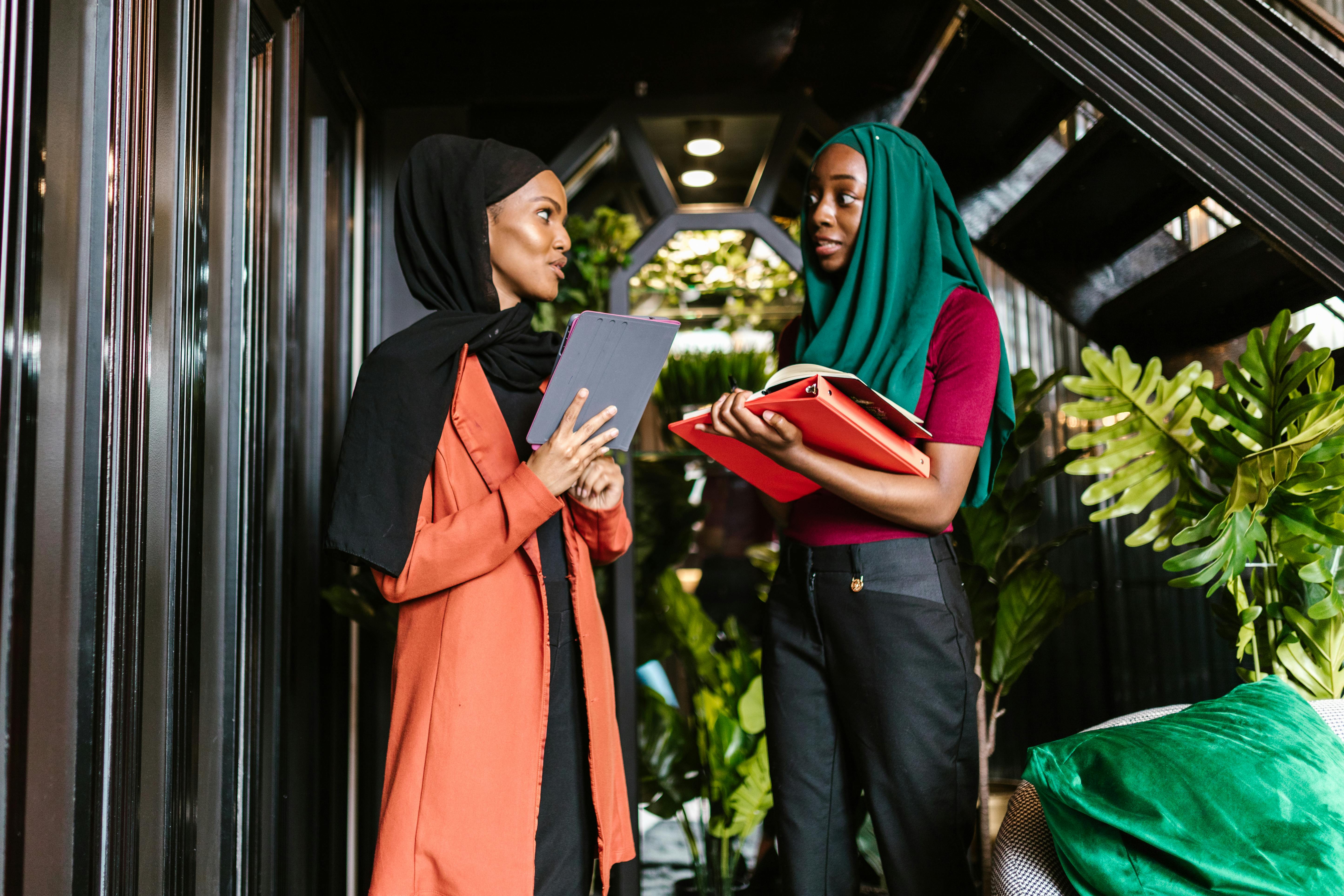 women in hijab working in an office