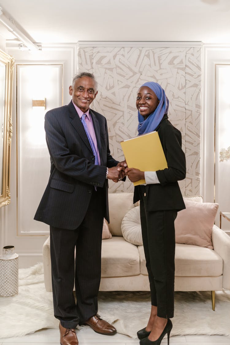 Businessman And Businesswoman Shaking Hands