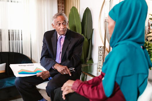Diverse business meeting discussing energy volume in an office setting.