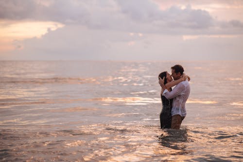 Romantic Couple Kissing Each Other at the Beach