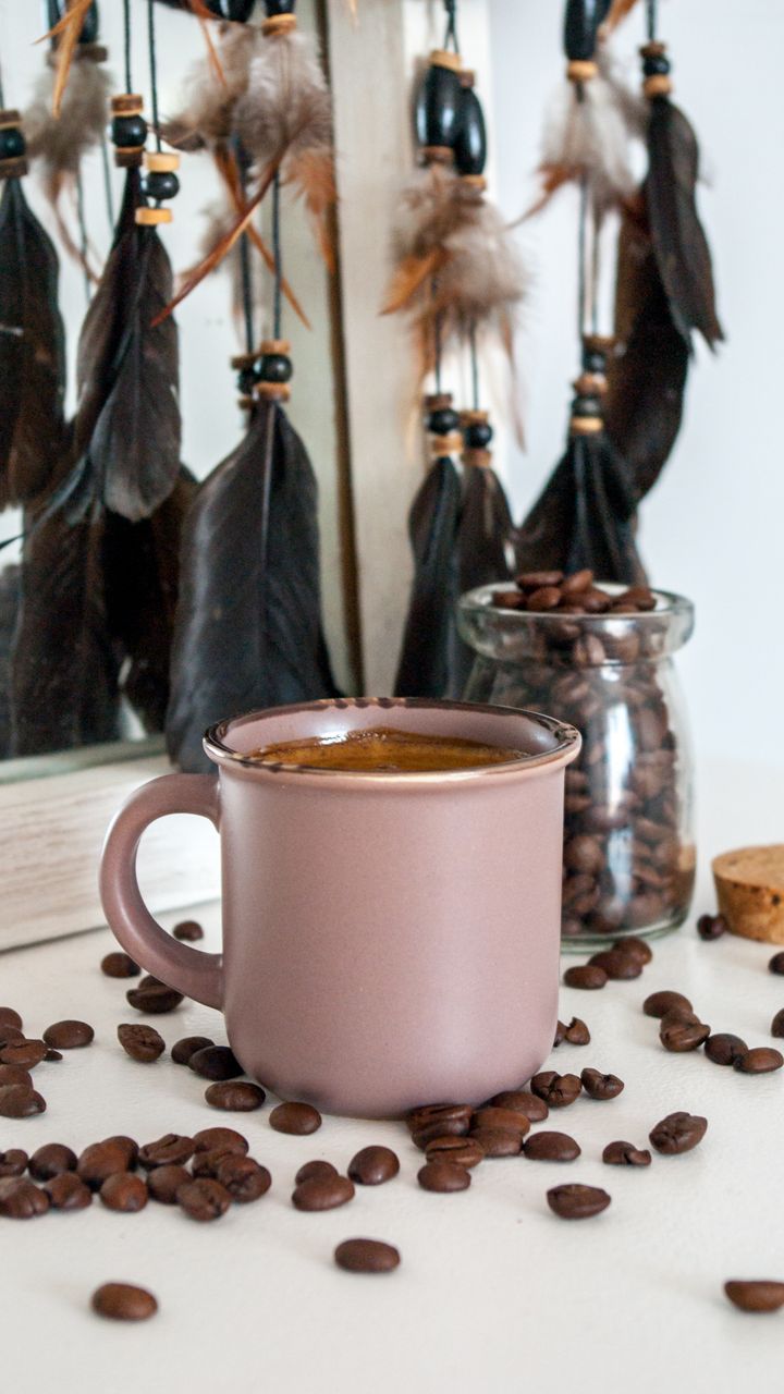 Small wooden beaded pendant light hanging above a cozy boho coffee bar nook