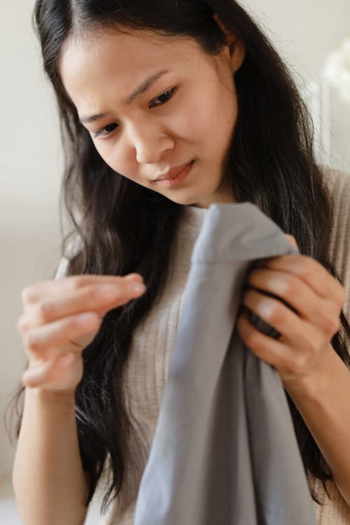 A Woman Holding a Clothes