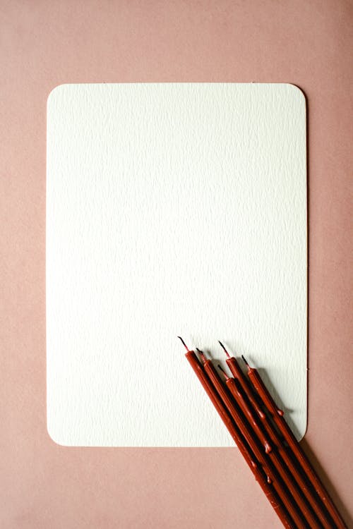 Red Candles on a Blank Textured Paper