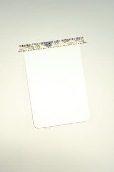 A blank card taped to a surface, perfect for notes or mockups.