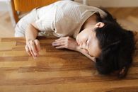 A Woman Sulking on the Wooden Table