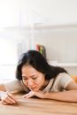 Crying Woman Sitting on Chair Looking on a Ring