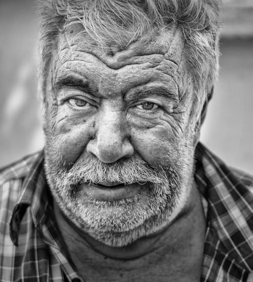 Free A Grayscale Photo of a Bearded Man Stock Photo