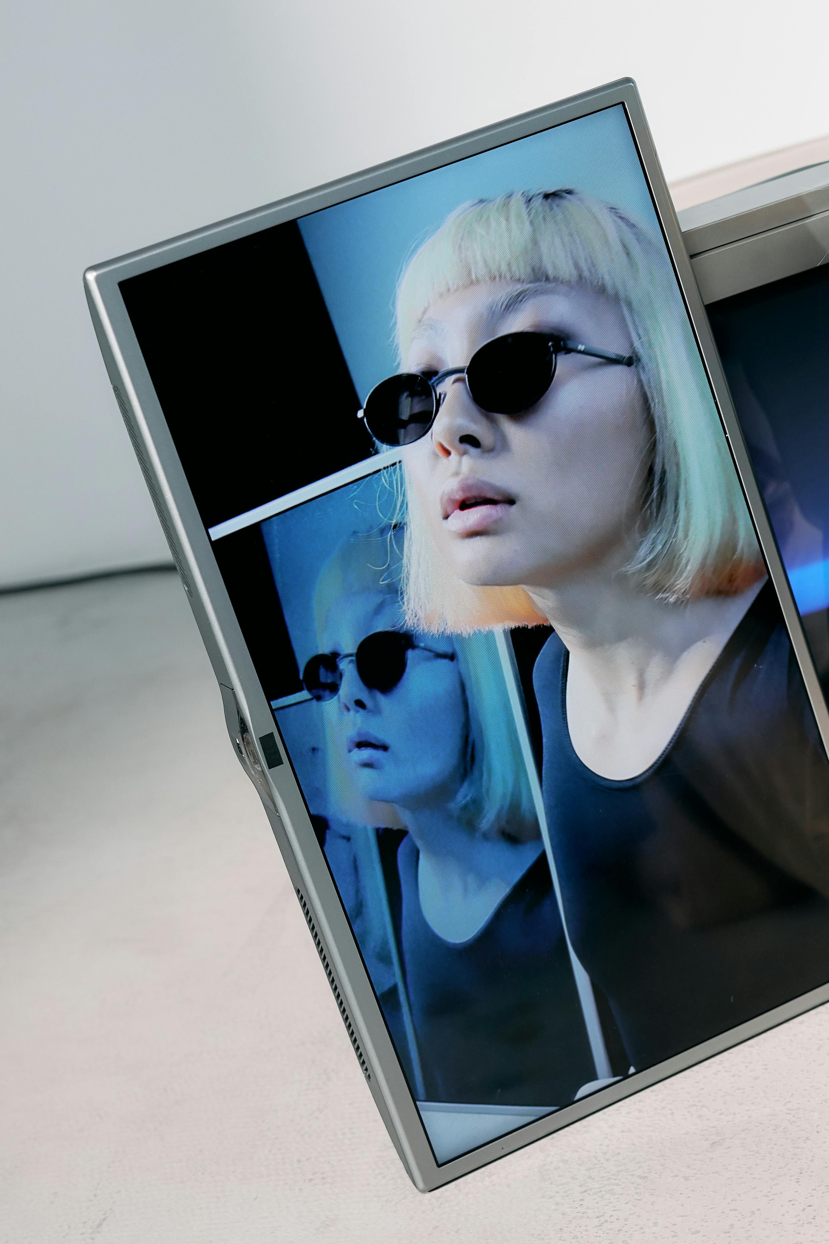 Woman in Black Tank Top Wearing Sunglasses