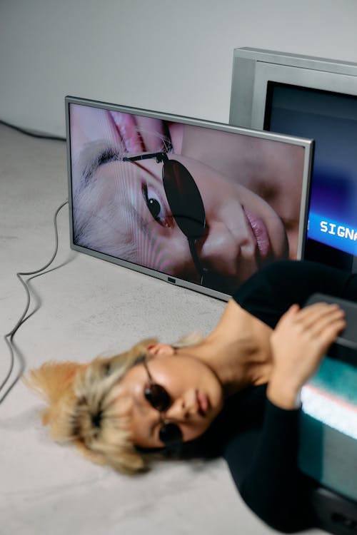 Photo of Woman Laying on the Ground