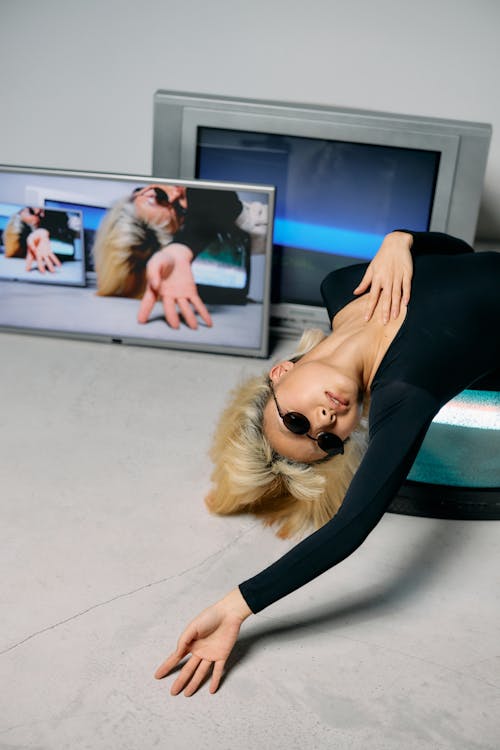 Photo of Woman on Top of Television