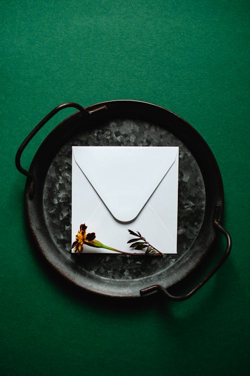 An Envelope on a Metal Tray