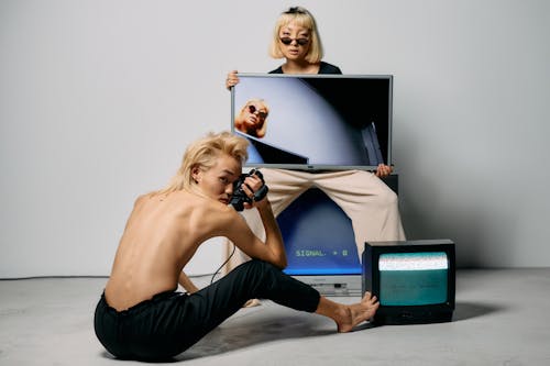 Photo of Woman Sitting on a Television