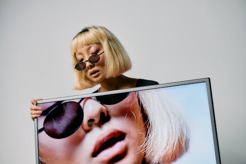 Woman Wearing Black Sunglasses With Blonde Hair