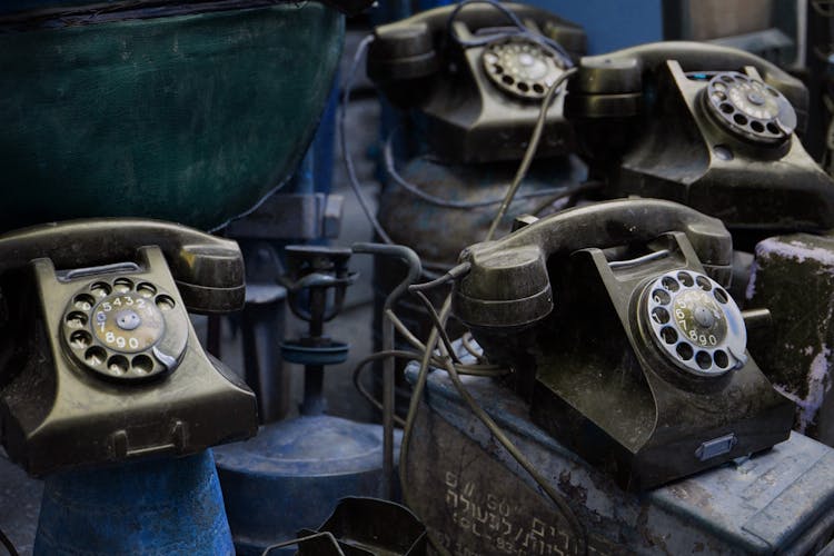 A Close-Up Shot Of Old Telephones