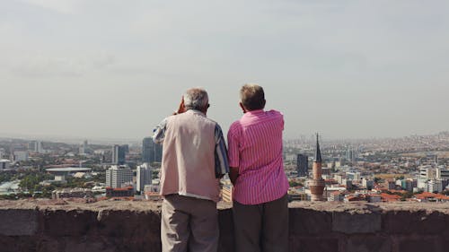 Elderly Men on the Rooftop Enjoying the City View