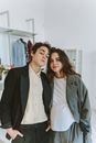 Woman in White Dress Shirt and Gray Blazer Standing Beside Woman in Gray Blazer
