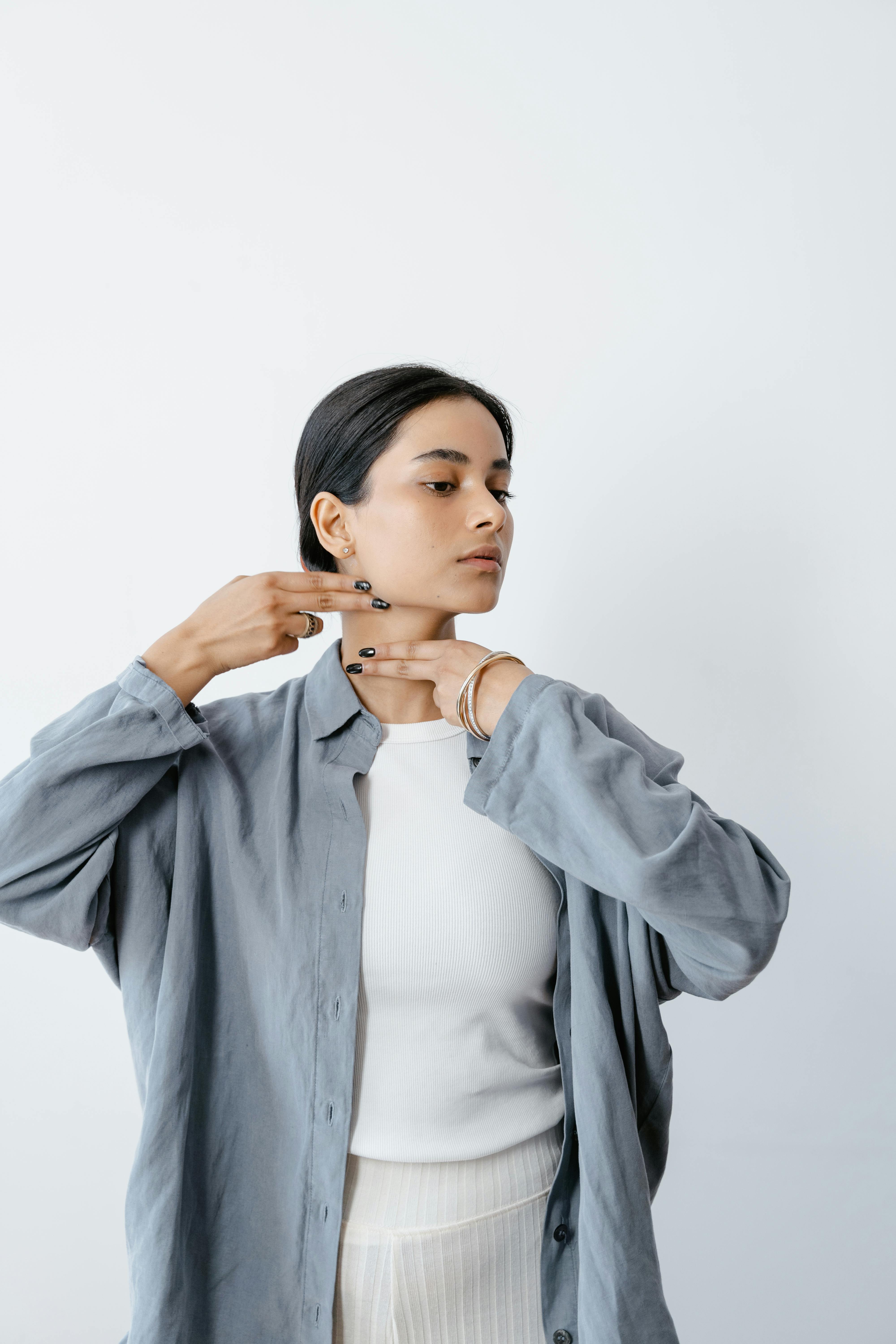 woman doing facial massage on her facial skin