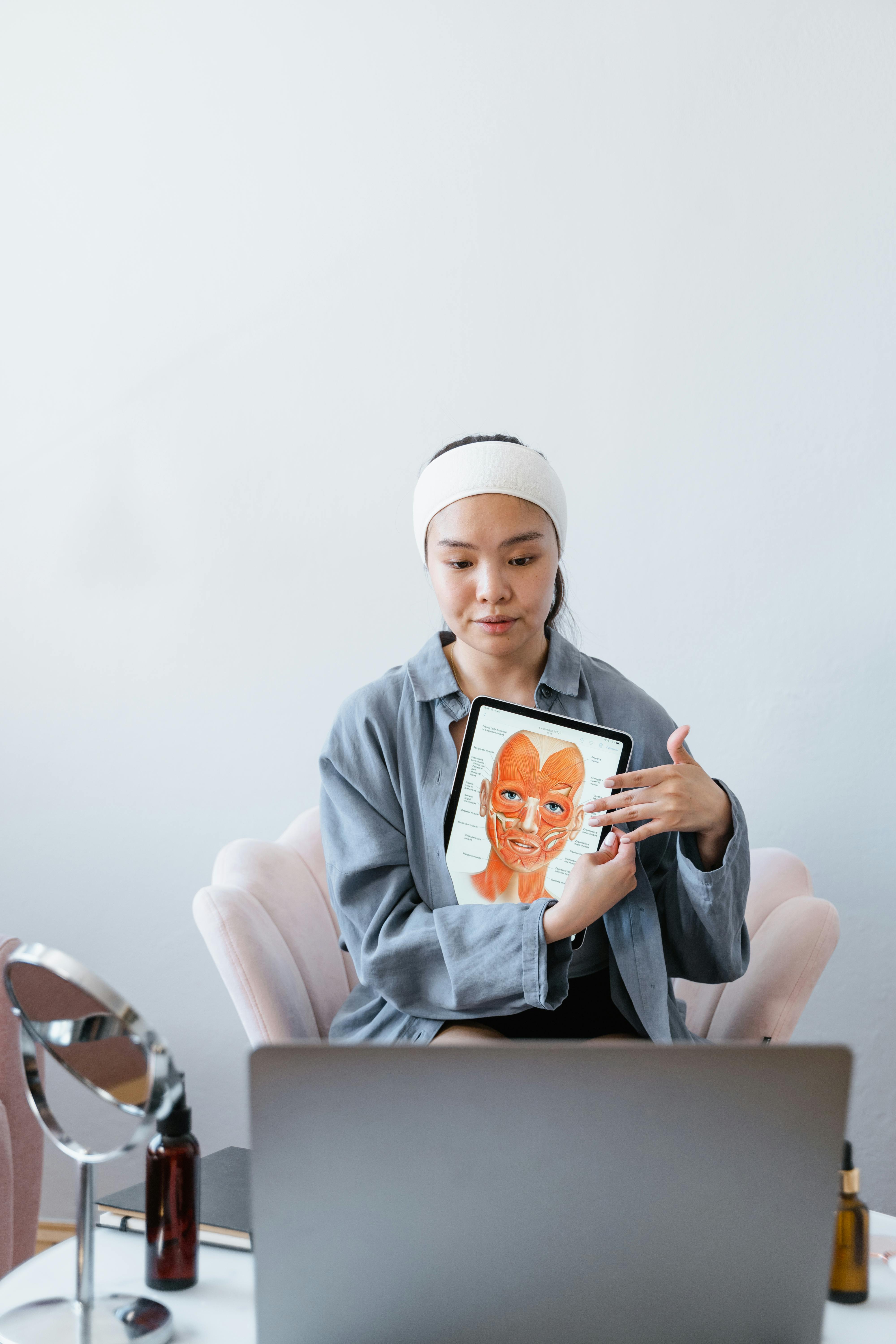 a woman holding a human s face diagram