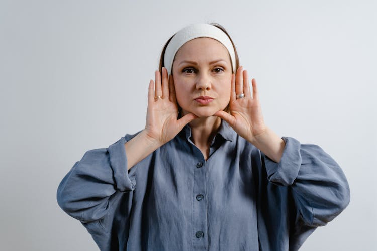 A Woman Showing The Contour Of Her Face