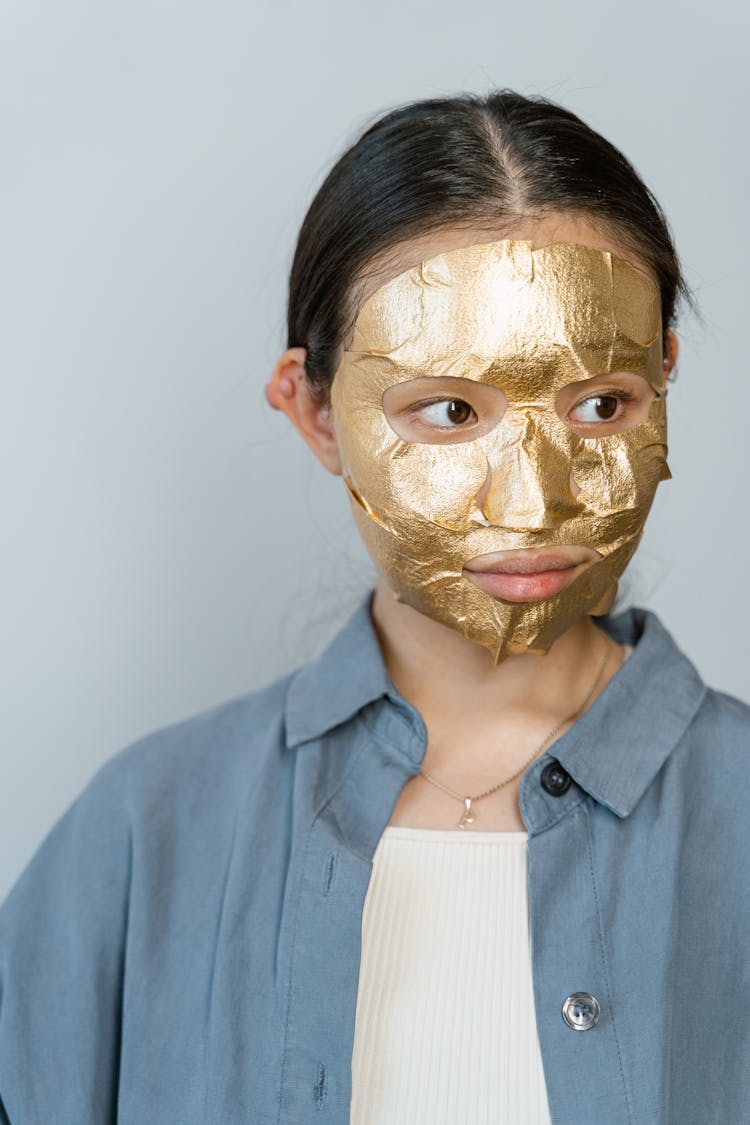 A Woman Wearing A Facial Mask For Skin Care