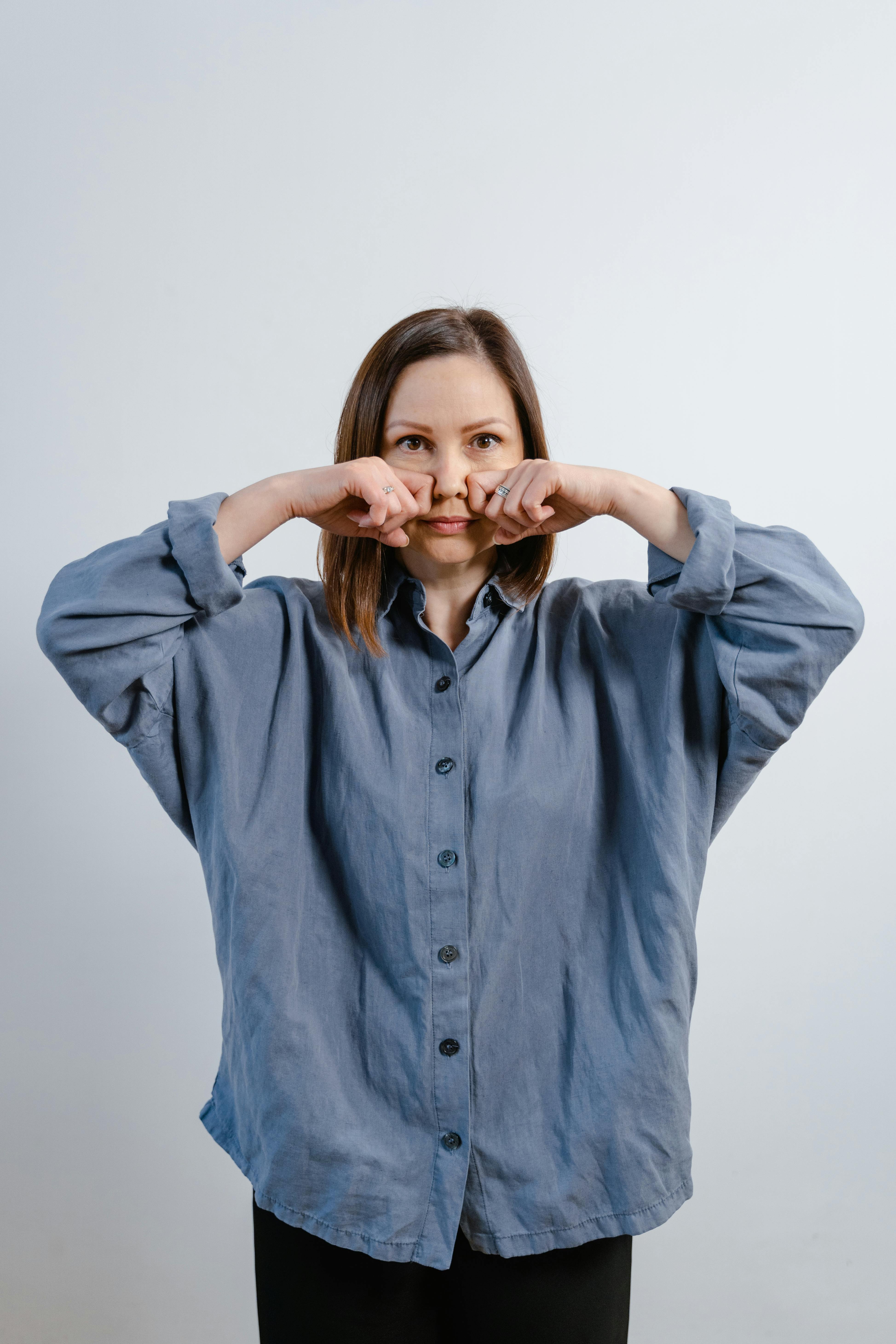 Woman In Blue Button Up Long Sleeve Shirt Free Stock Photo