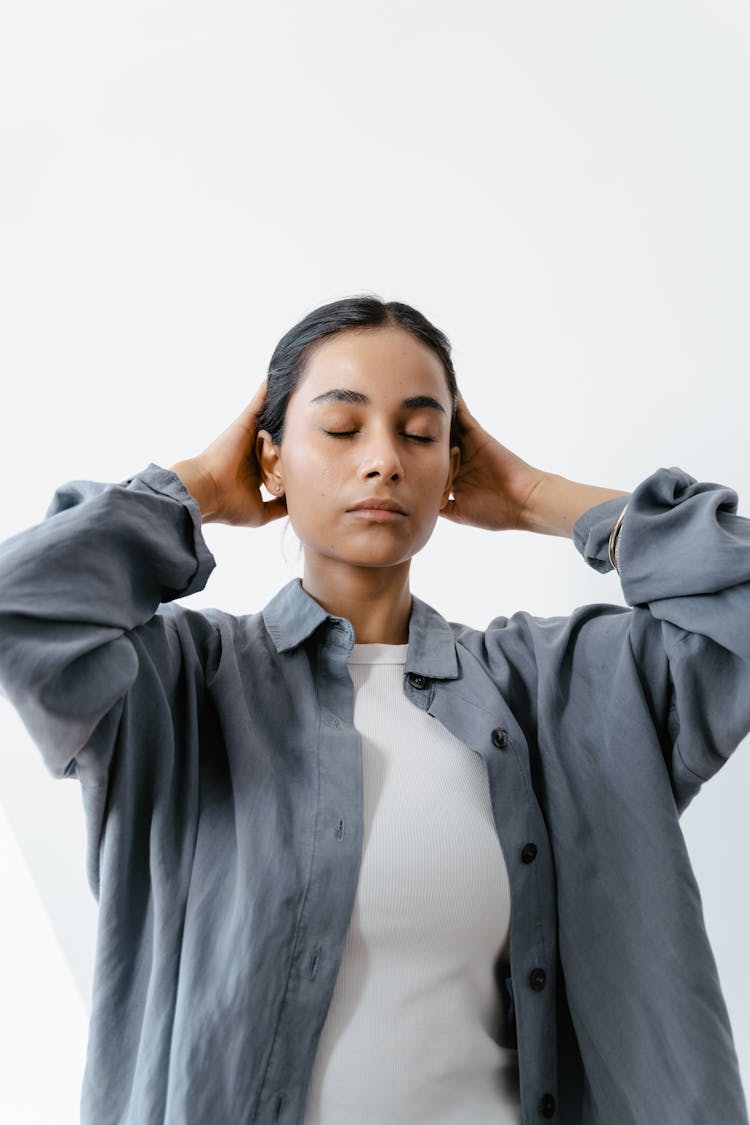 A Woman Massaging Her Head