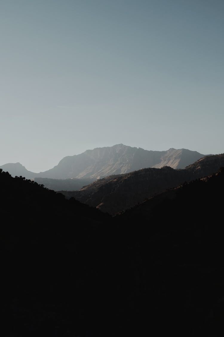 Mountain Ridge Under Cloudless Sky In Daytime