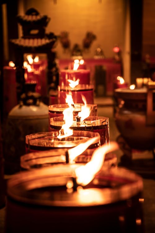 Free Row of burning candles creating a warm ambiance in a Jakarta temple Stock Photo